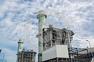 View of pipelines and towers, heavy industry.