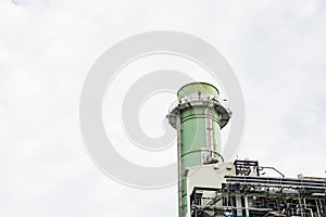 View of pipelines and towers, heavy industry.