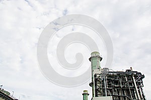 View of pipelines and towers, heavy industry.