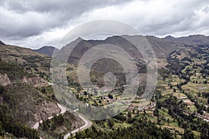 View of Pisac Archaeological Park and green mountains of the Sacred Valley of the Incas, Peru