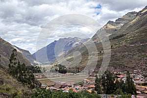 View of Pisac Archaeological Park and green mountains of the Sacred Valley of the Incas, Peru