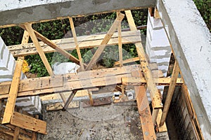 view of pit dug under foundation for a barbecue in annex to house. Site on which the walls are built of gas concrete blocks with