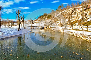 View of Pivka river near Postojna cave entrance at nice winter day Slovenia