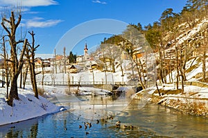 View of Pivka river near Postojna cave entrance at nice winter day Slovenia