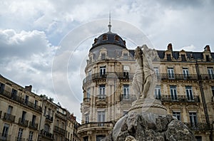 View of the place Comedie and the old fountain of the three graces in Montpellier in France