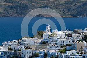 View of Plaka village with traditional Greek church. Milos island, Greece