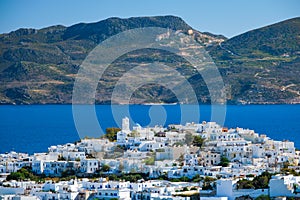 View of Plaka village with traditional Greek church. Milos island, Greece