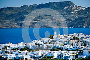 View of Plaka village with traditional Greek church. Milos island, Greece