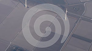 View from a plane window. Sea and wind farms