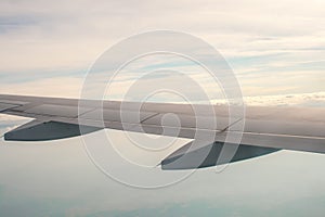 A view from the plane on the wing and clouds