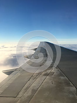 The view of the plane wing up in the clouds