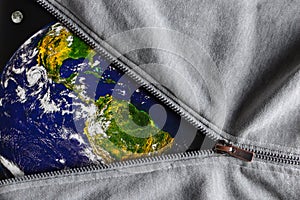 View of the planet the Earth and the Moon when we unfasten the gray metal zipper clasp