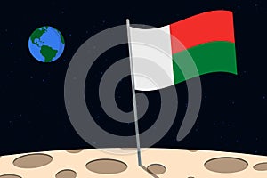 View of planet Earth from the surface of the Moon with the Madagascar flag and holes on the ground