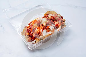 plastic container of tostilocos