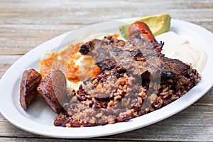 plate of carne asada and huevos rancheros photo