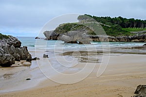 View on Playa de Palombina Las Camaras in Celorio, Green coast of Asturias, North Spain with sandy beaches, cliffs, hidden caves, photo
