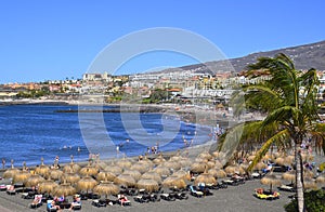 View of Playa de Torviscas beach with black volcanic sand on the south of Tenerife,Canary Islands,Spain.