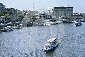 View of pleasure boats moored to the pier of the river port. Dnipro river, Kyiv, Ukraine