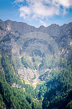 View from PodolÅ¡eva to rockface of mountain Raduha in Slovenia