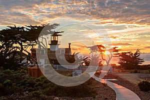View of Point Pinos lighthouse at sunset, Monterey coast. photo