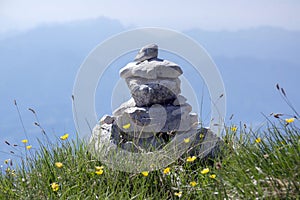 View point with white stone cairns on hiking trail Alta Via del Monte Baldo, ridge way in Garda Mountains photo