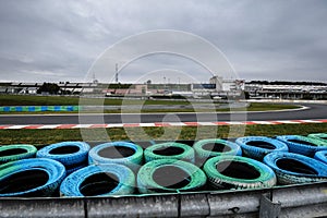 View from the pole position in a racetrack. Wheel close up