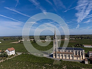 View on Pomerol village, production of red Bordeaux wine, Merlot or Cabernet Sauvignon red wine grapes on cru class vineyards in