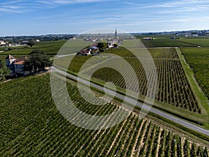 View on Pomerol village, production of red Bordeaux wine, Merlot or Cabernet Sauvignon red wine grapes on cru class vineyards in