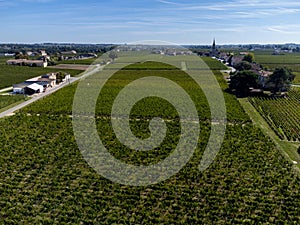 View on Pomerol village, production of red Bordeaux wine, Merlot or Cabernet Sauvignon red wine grapes on cru class vineyards in