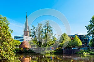 View of the pond and St. Lamberti Church of Oldenburg, Germany