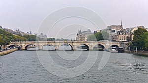 View of Pont Neuf arched stone bridge in Paris