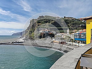 View of Ponta do Sol, a small touristic village in the city of Funchal, main avenue facing the sea, with residential buildings