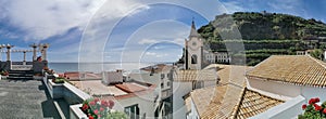 View of Ponta do Sol, a small touristic village in the city of Funchal, main avenue facing the sea, with residential buildings,