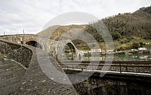 view of the Ponte della Maddalena or Ponte del Diavolo in Borgo a Mozzano Lucca. tuscany Italy