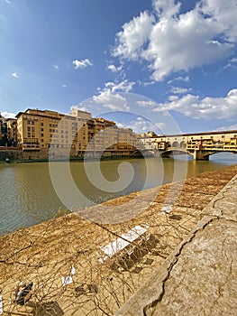 View from the Ponte Vecchio over the Arno river, in the Florence, Italy.