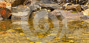 View of a pool with stones on the botton