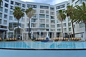 View from the pool to hotels building of Protea Hotel President