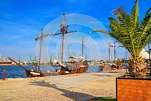 View of the port of Varna and the embankment with pleasure ships, harbor cranes in the background