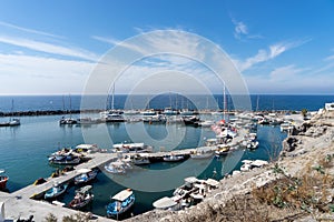 View on port of Vlichada town full with small fishing boats at Santorini island