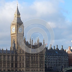 View of Portcullis House and Big Ben in London, UK under blue cloudy sky photo