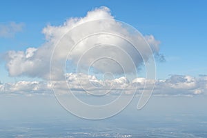 View from porthole, airplane window to beautiful cloudy sky - cloudscape