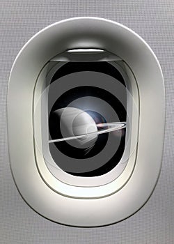 View from a porthole on the Saturn background. Elements of this image furnished by NASA