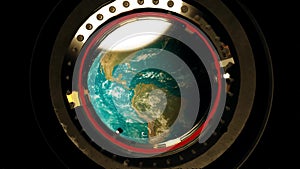 View from a porthole of space station the Earth.
