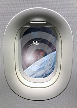 View from porthole window on spacecraft launch into space. Elements of this image furnished by NASA