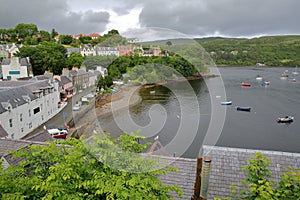 View of Portree Bay from Portree with traditional slate roofs in the foreground, Isle of Skye, Highlands, Scotland, UK