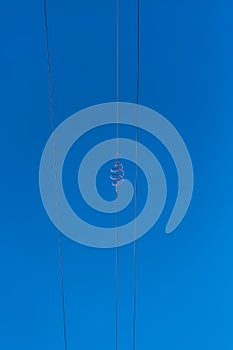 View of a power lines with blue sky as background