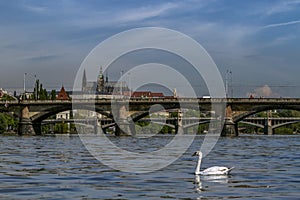 View of the Prague Castle and the bridges on the Vltava River in a sunny morning. Prague, Czech Republic.