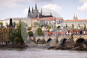 View of Prague Castle with Charles Bridge in the foreground photo