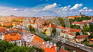 View of Prague Castle over red roof from Vysehrad area at sunset lights, Prague, Czech Republic. Scenic view of Prague city,