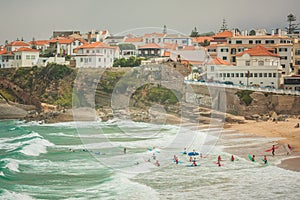 View Of Praia das Macas with group of surfers. Portugal